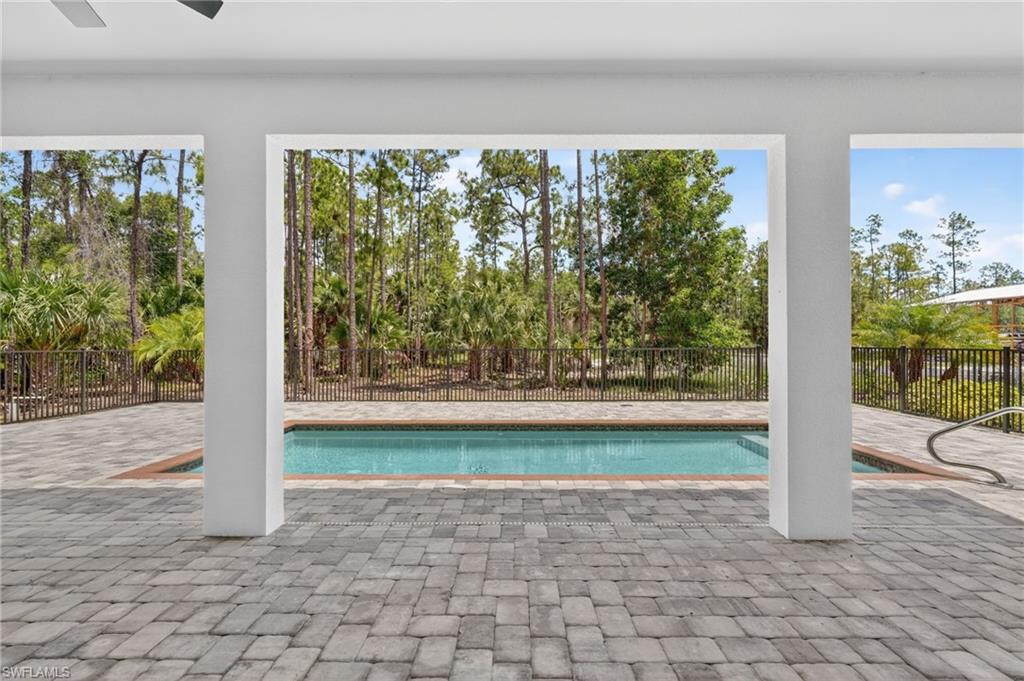 View of Pool area and yard from Great room and Dining area