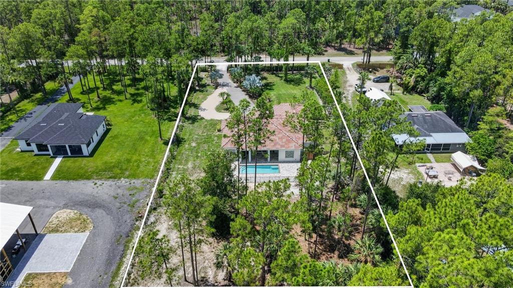 Lovely landscaped lot, 100% upland, no issues with building any outdoor structures or guest house