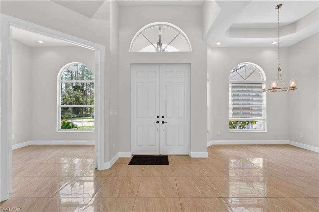 Front entry, den and formal dining area