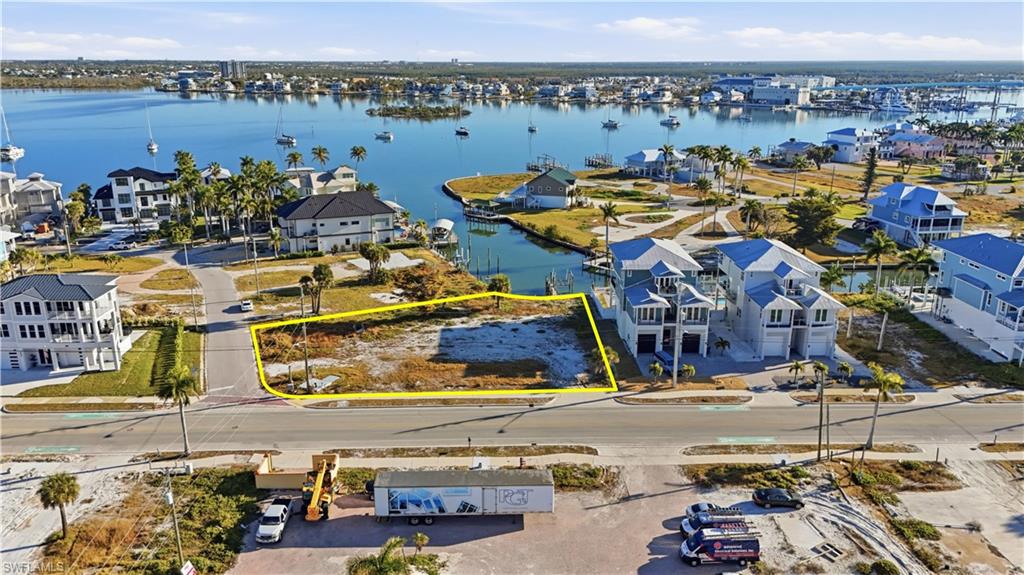 Aerial perspective of suburban area with a large body of water - Virtually Edited Image