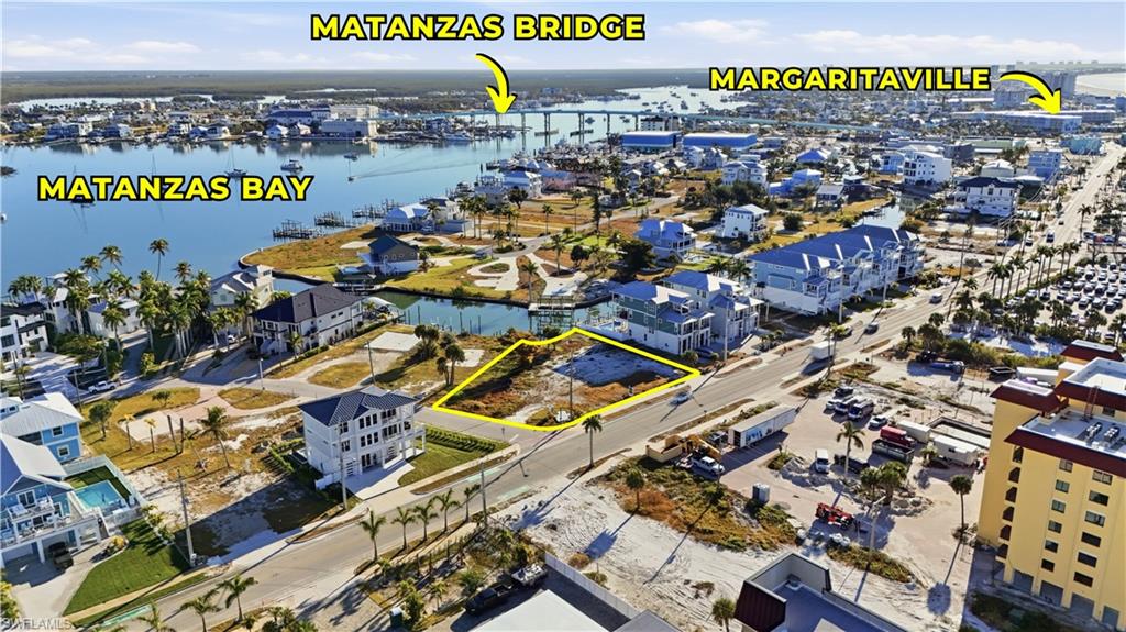 Aerial view of residential area featuring a nearby body of water - Virtually Edited Image