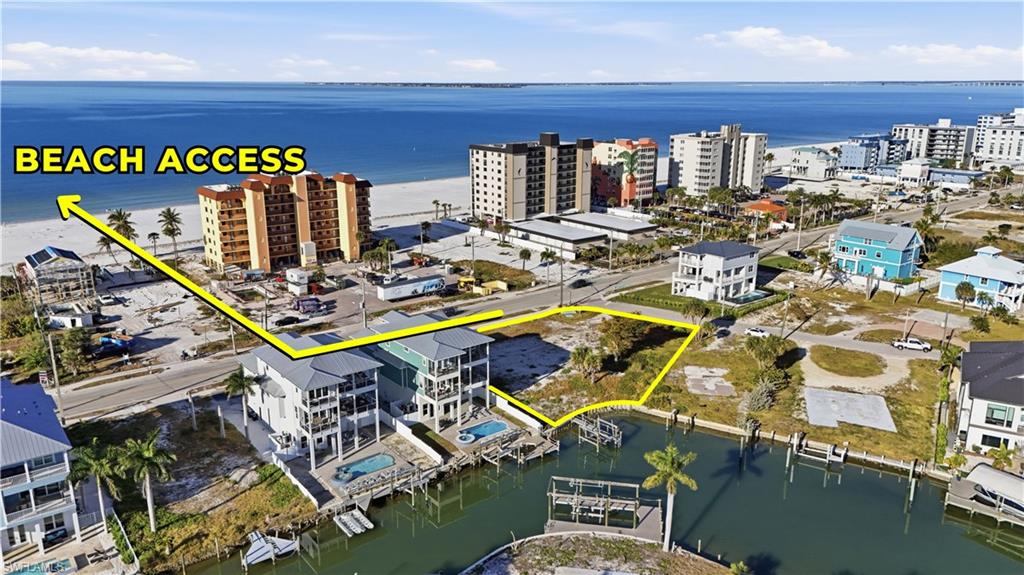 Drone / aerial view of a nearby body of water and apartment complex - Virtually Edited Image