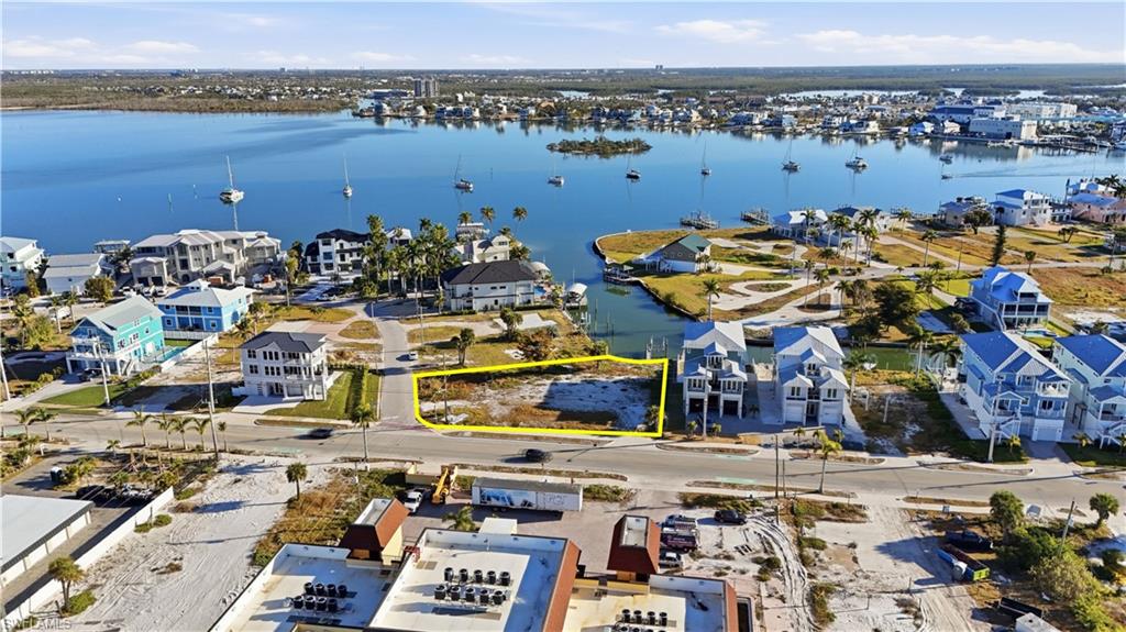 Aerial perspective of suburban area featuring a large body of water - Virtually Edited Image