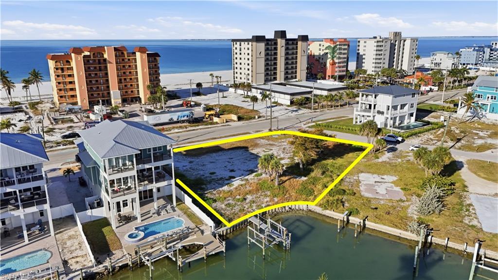 Drone / aerial view of a large body of water and apartment complex - Virtually Edited Image