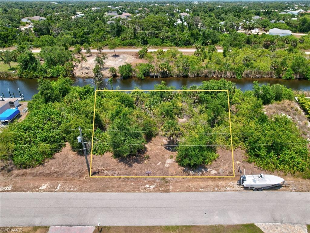 View of property location featuring property boundaries highlighted and a large body of water