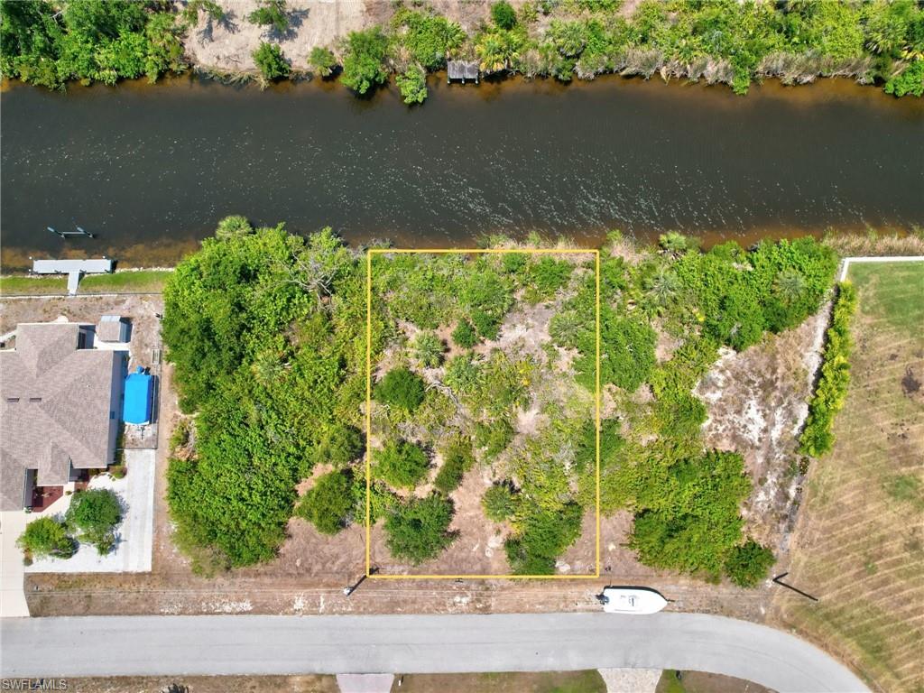 View of property location featuring property parcel outlined and a nearby body of water