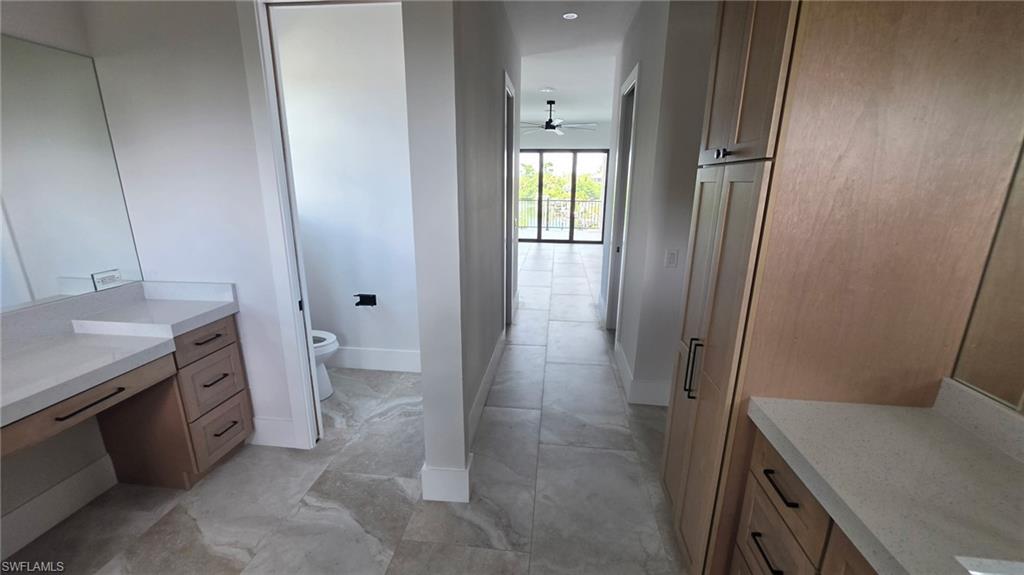 Stone-finish tile flooring throughout