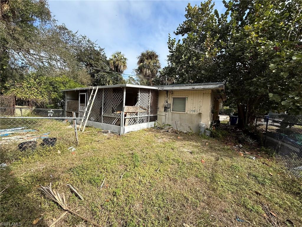 View of front of house with a wooden deck