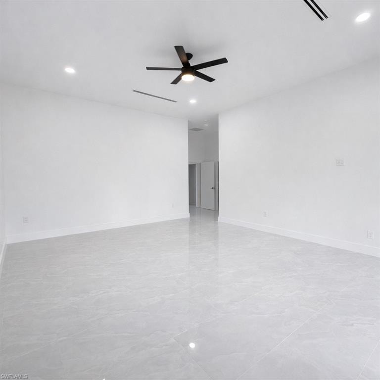 Spare room with ceiling fan and recessed lighting