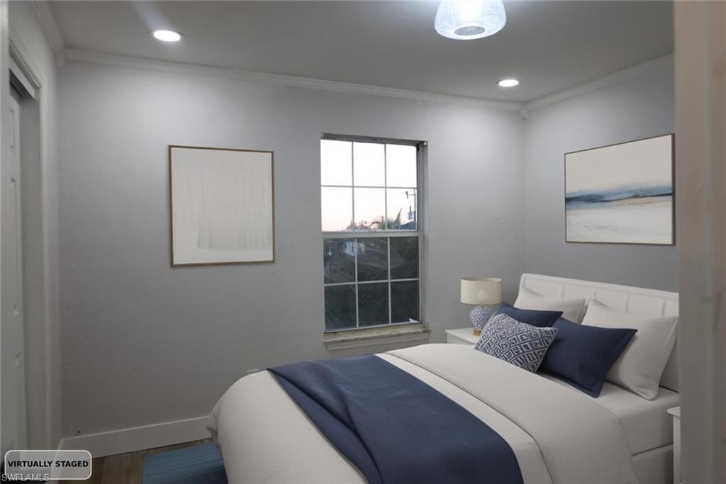Bedroom with ornamental molding, wood finished floors, and recessed lighting