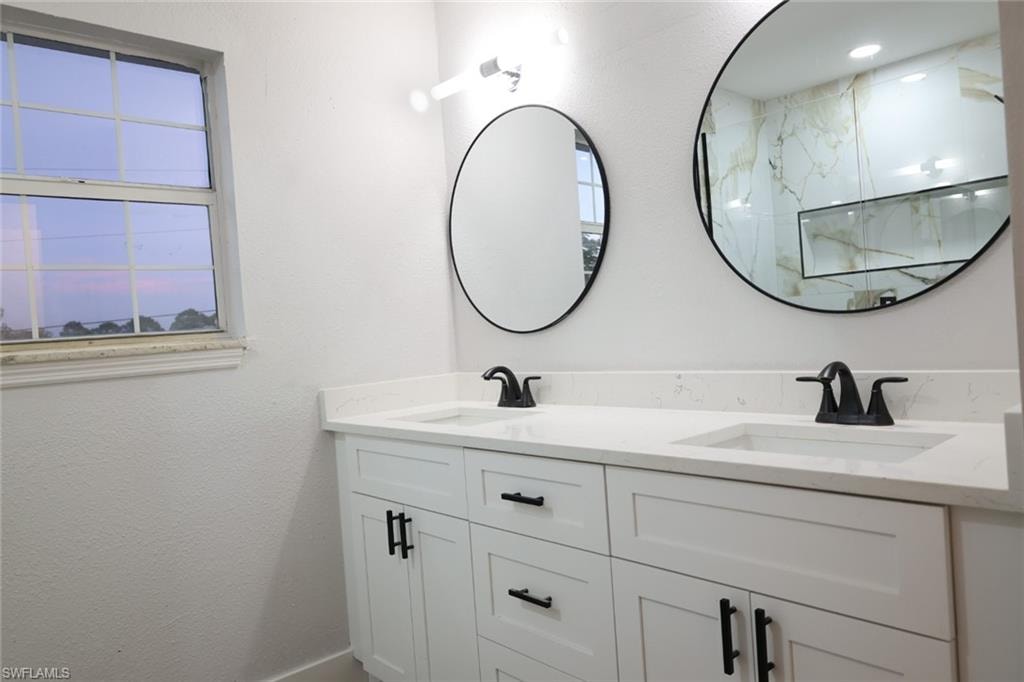 Bathroom featuring double vanity