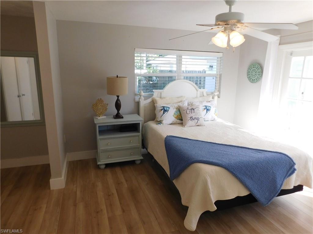 Bedroom featuring wood finished floors and ceiling fan
