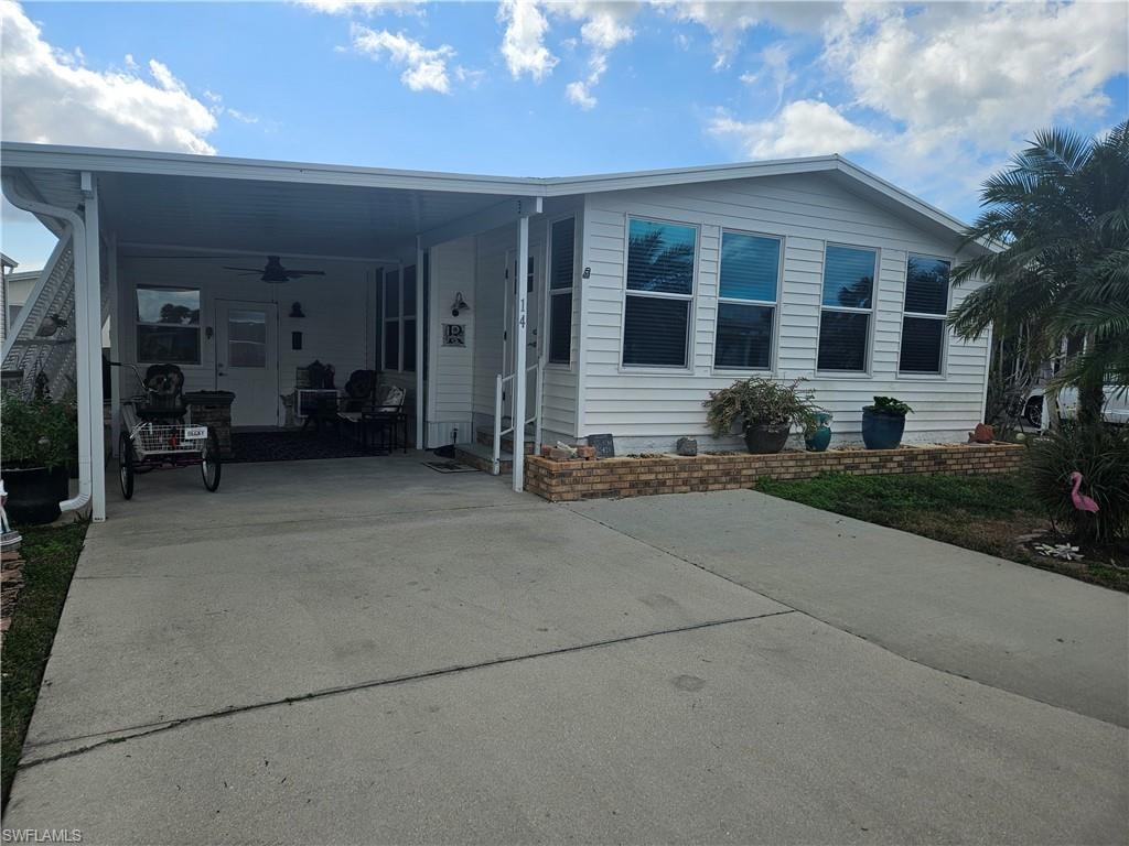 Manufactured / mobile home with ceiling fan and a carport