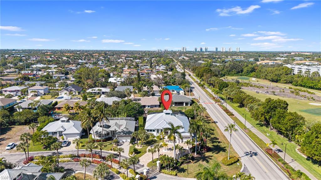 Aerial view of property and surrounding area with city skyline