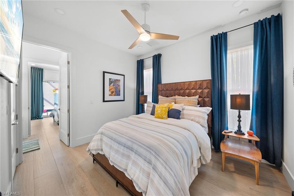 Bedroom featuring light wood-type flooring and a ceiling fan