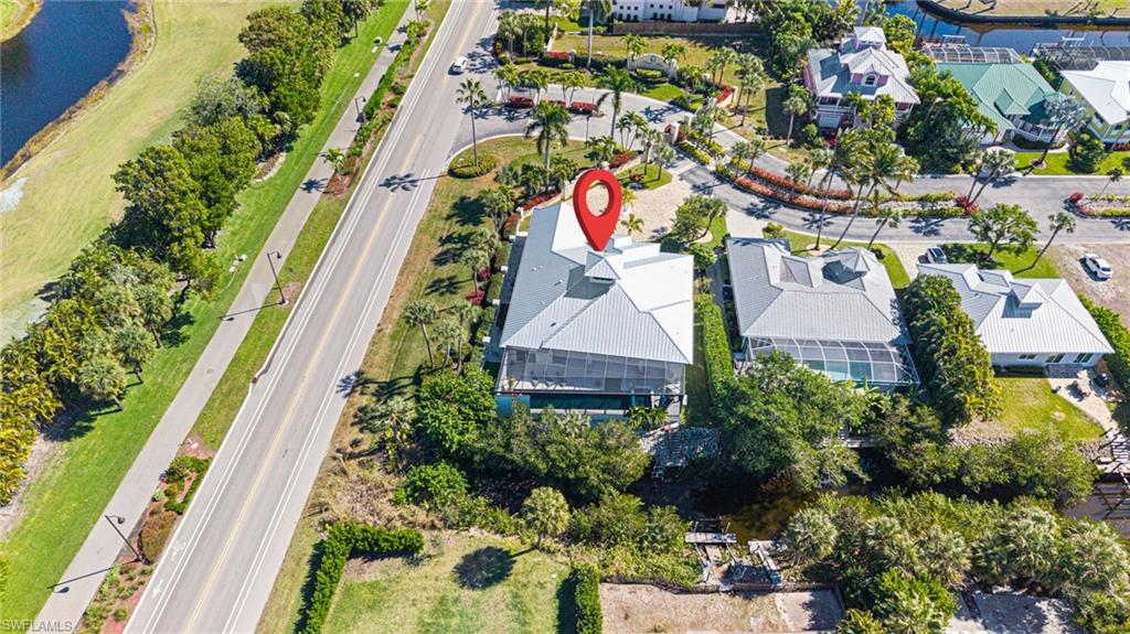 Aerial overview of property's location with a nearby body of water