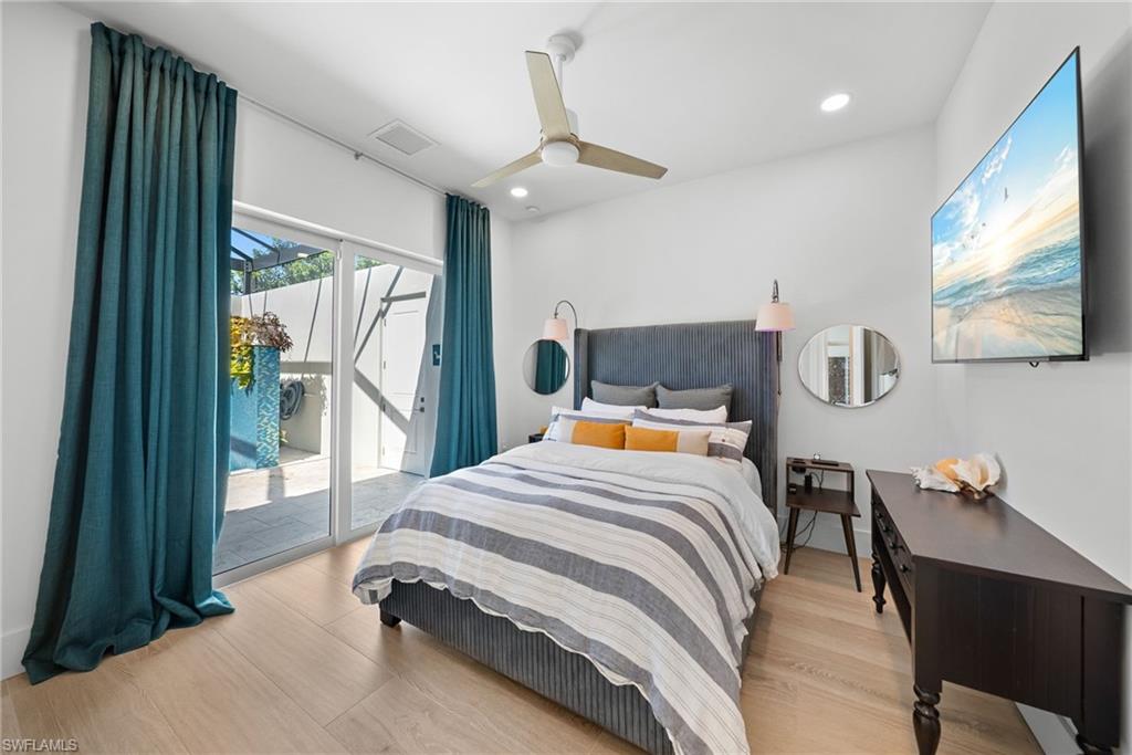 Bedroom with access to outside, light wood-style flooring, recessed lighting, and ceiling fan