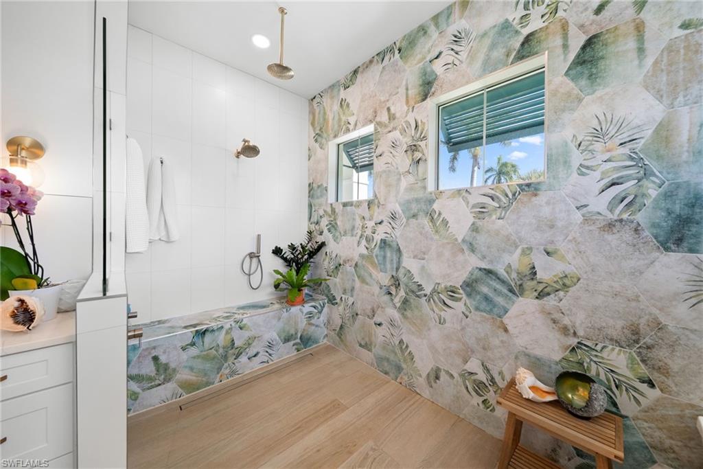Bathroom featuring a tile shower and recessed lighting