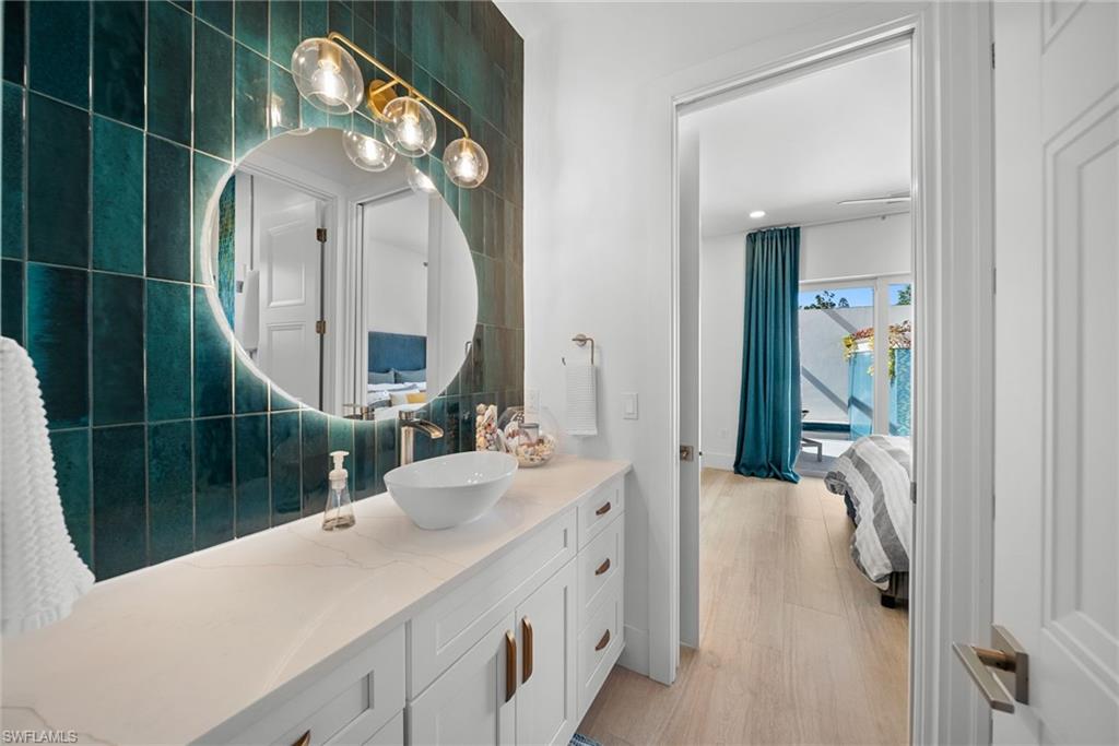 Bathroom with vanity and light wood-type flooring