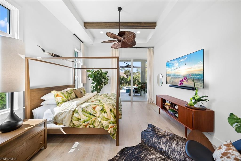 Bedroom featuring light wood finished floors, access to exterior, recessed lighting, and a ceiling fan