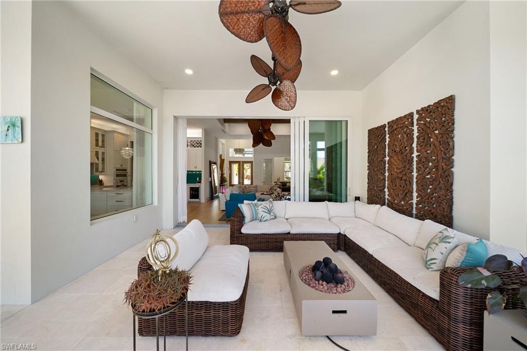 Living room featuring a ceiling fan and recessed lighting