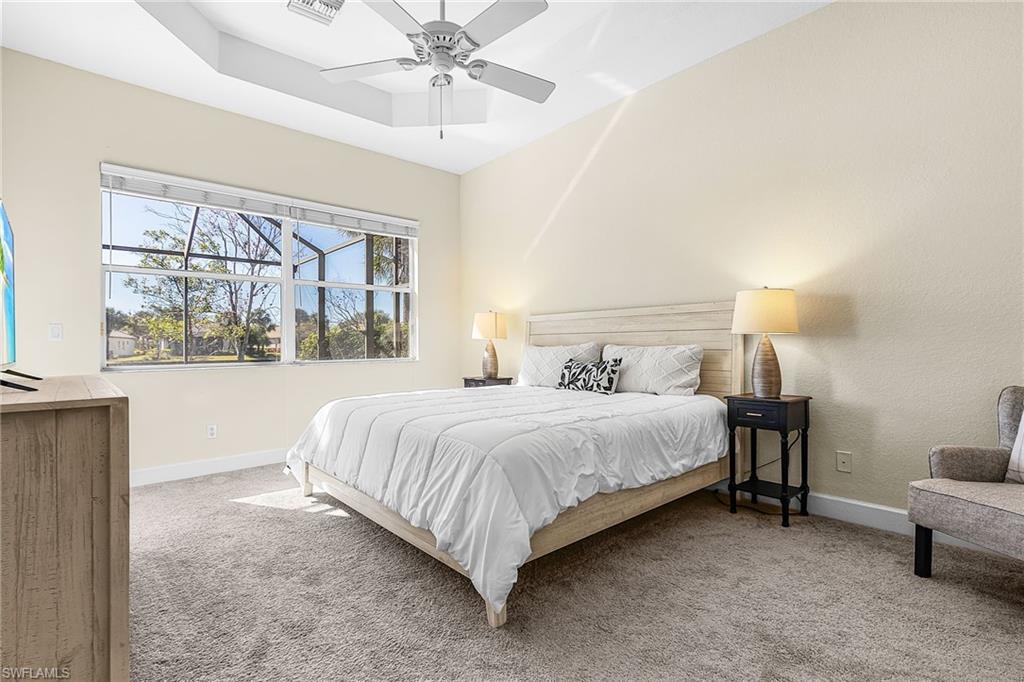 master bedroom view overlooking pool and lake