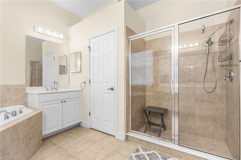 large walk in shower and split master sinks.