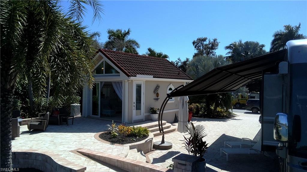 View of patio / terrace with an outdoor structure and a storage structure