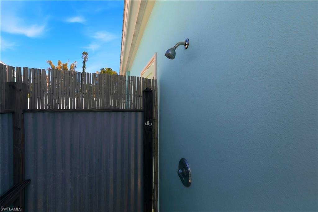 Back of property with stucco siding and a patio area