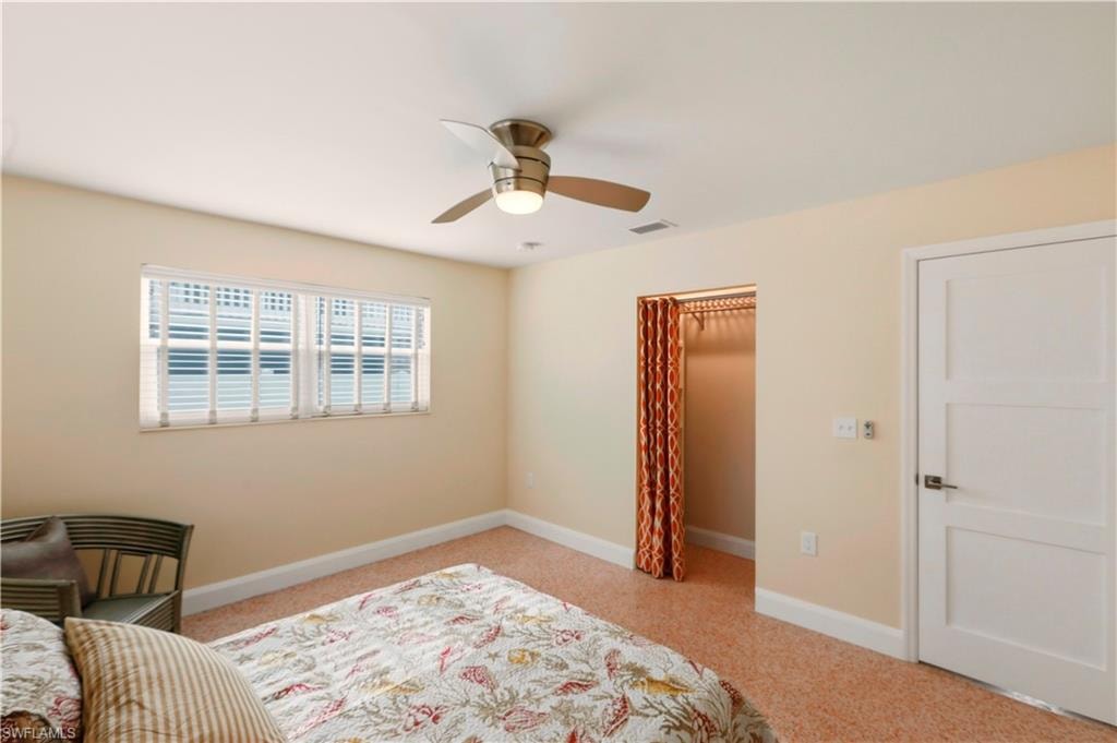 Bedroom featuring carpet floors and ceiling fan