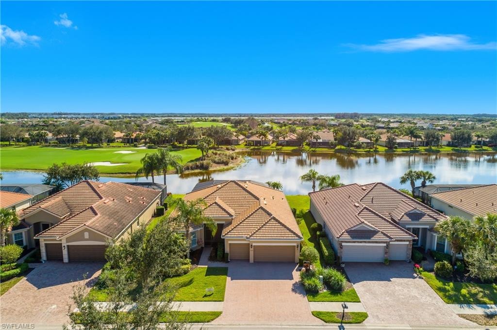 Aerial perspective of suburban area with a nearby body of water