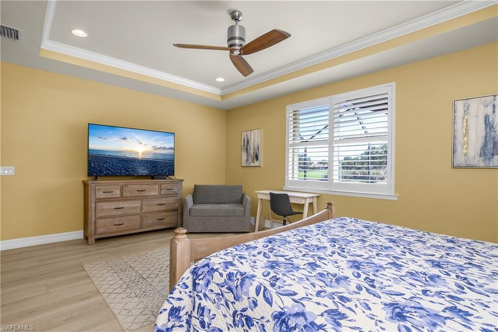 Bedroom featuring ornamental molding, ceiling fan, light wood finished floors, and recessed lighting