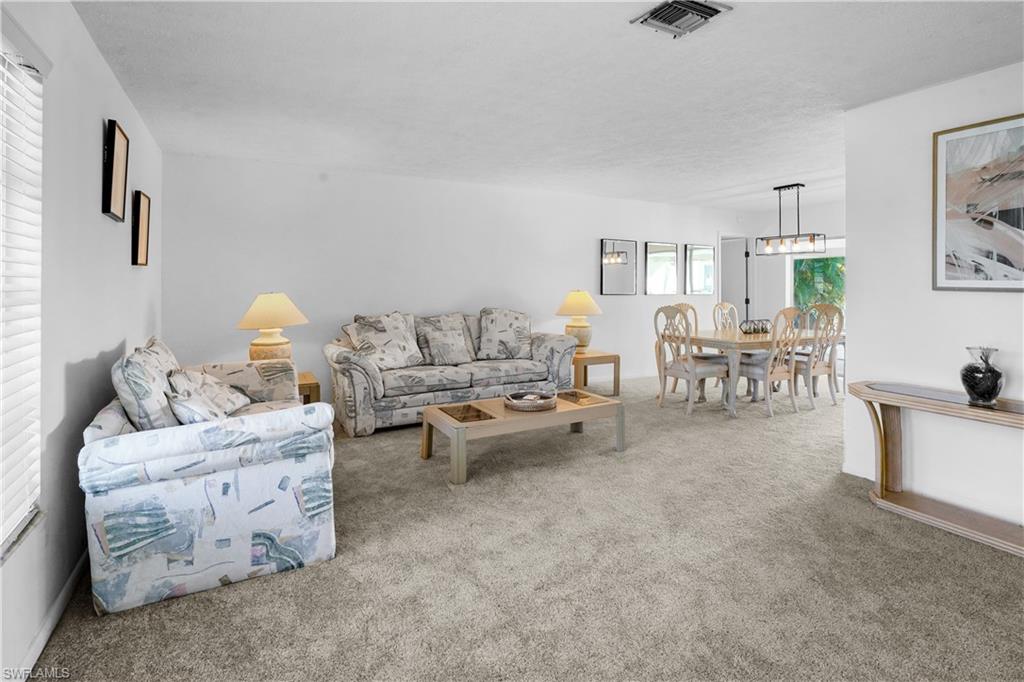 Large L-shaped living room and dinning area.