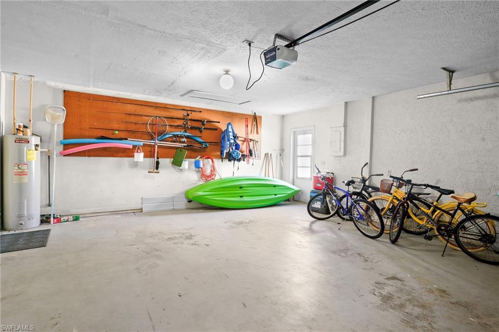 Aerial view of newer roof, a solar heated pool, boat dock and boat lift. Easy access from the home to the dock.