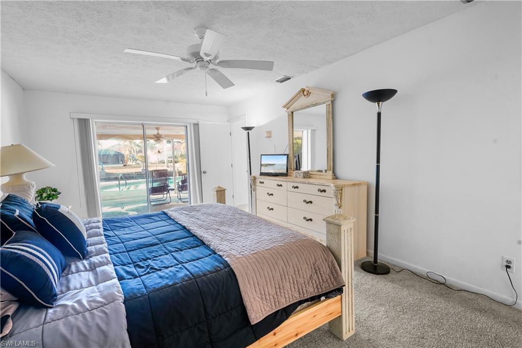 Large main bedrrom has a private bath, large walk-in closet and opens to the coverd lania.