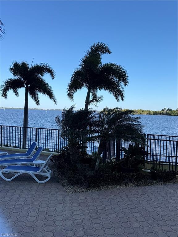 View of patio / terrace featuring a water view