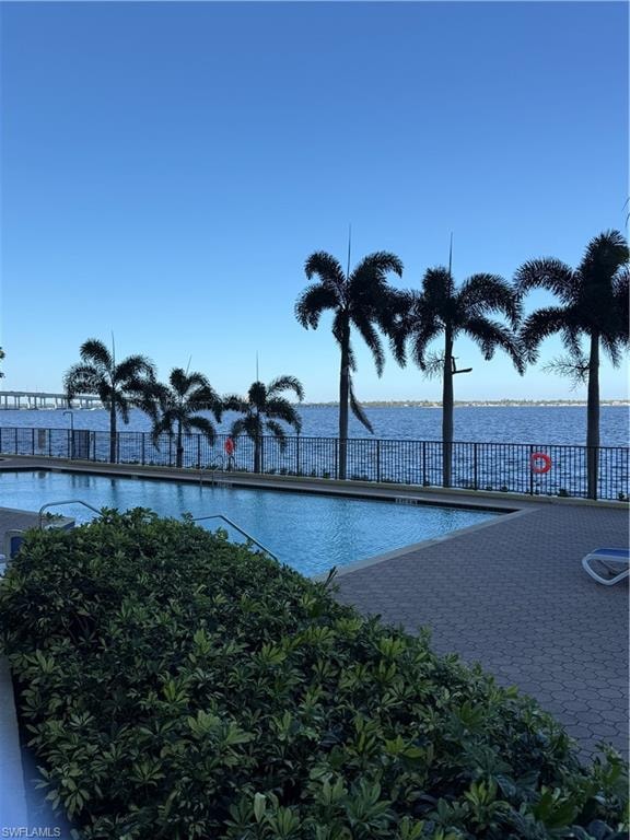 Community pool with a water view
