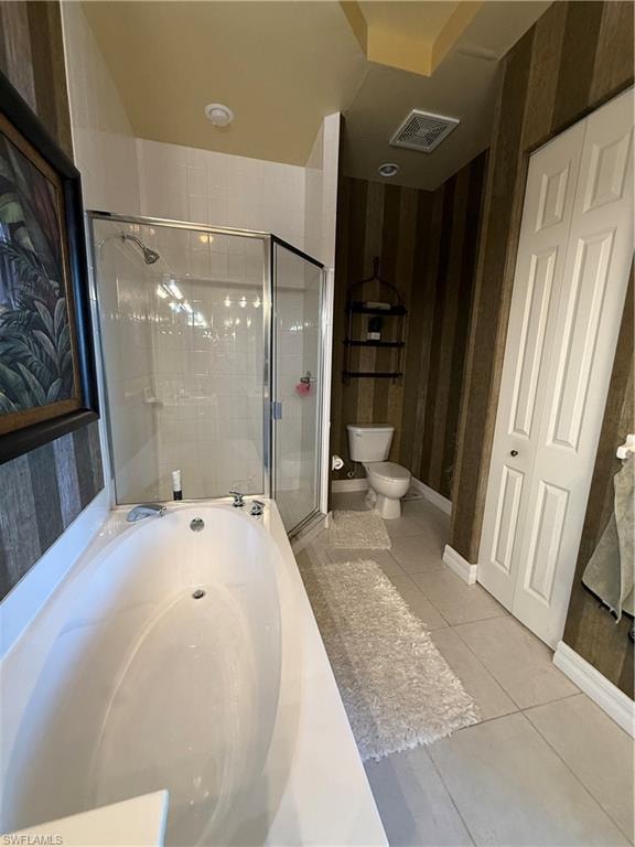 Full bath featuring a garden tub, light tile patterned floors, and a stall shower