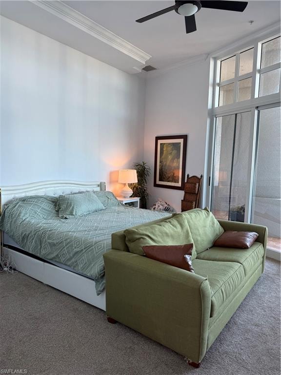 Carpeted bedroom with floor to ceiling windows, a ceiling fan, and crown molding