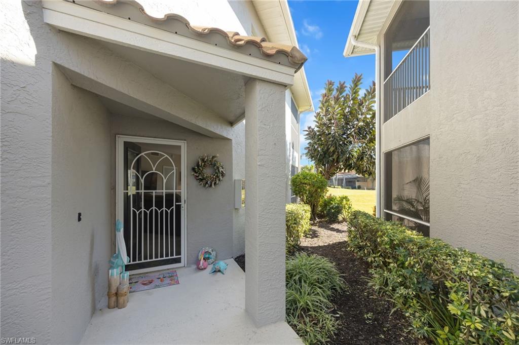 View of exterior entry with stucco siding