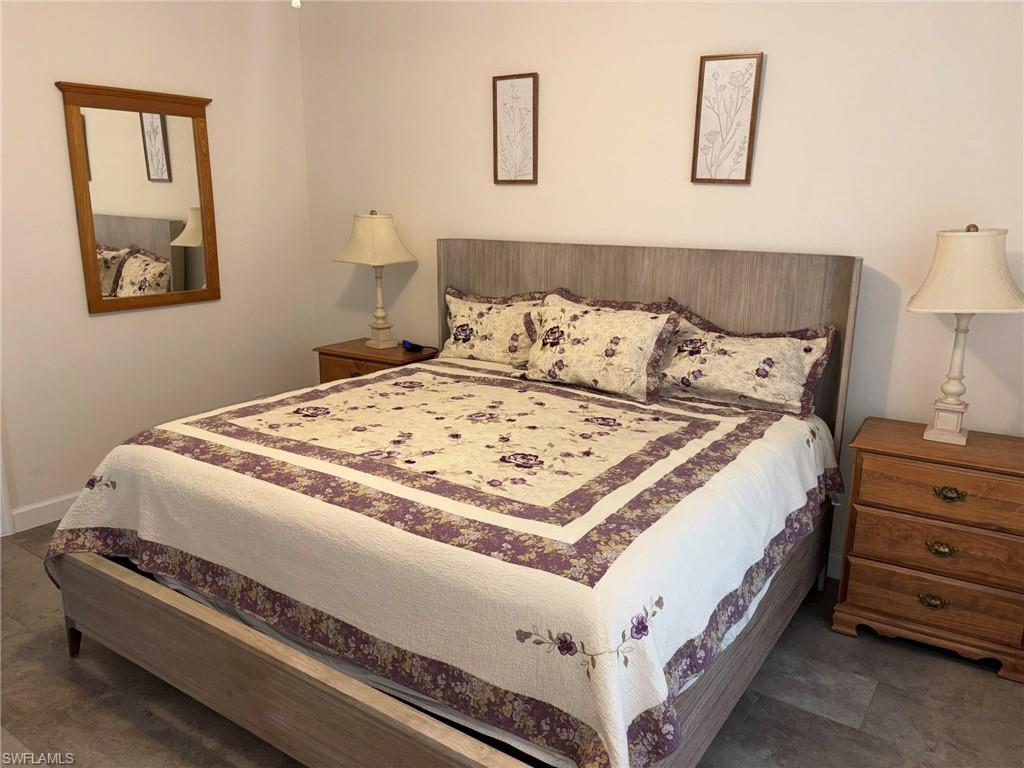 Bedroom featuring light wood-finish flooring and neutral wall tones