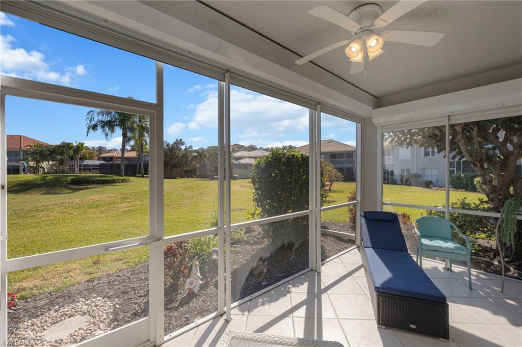 Sunroom / solarium featuring a ceiling fan