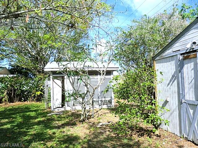 Storage sheds behind house