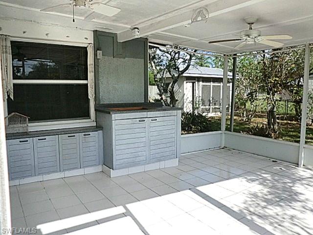 Matching remote fans in screen porch with cabinets