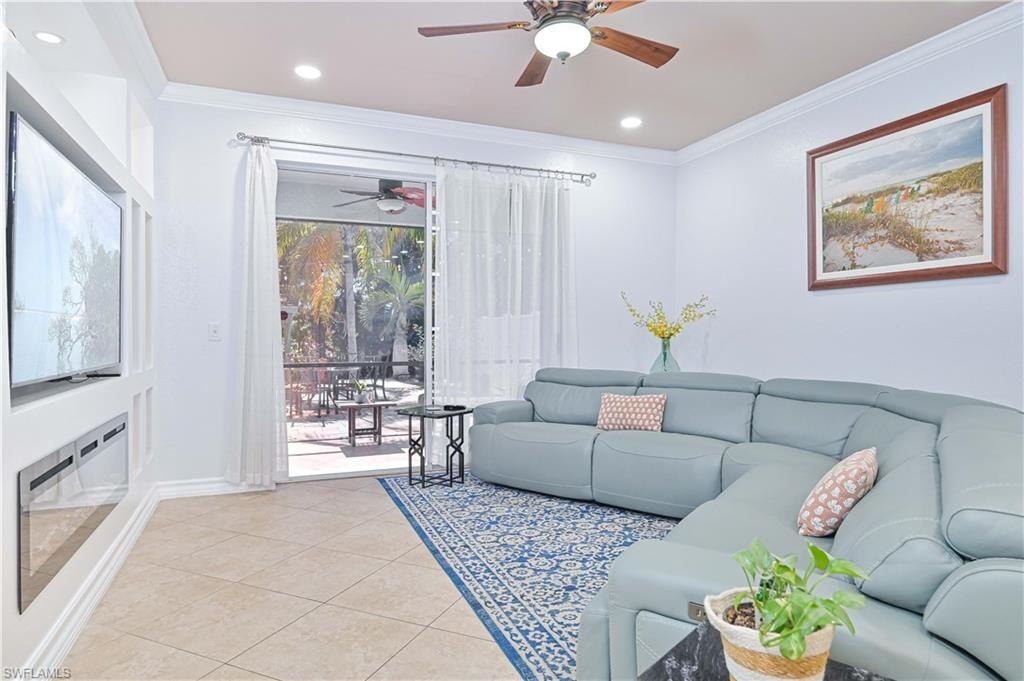Living room featuring ceiling fan, tile patterned flooring, ornamental molding, and recessed lighting