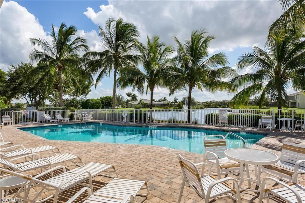Community pool with a patio
