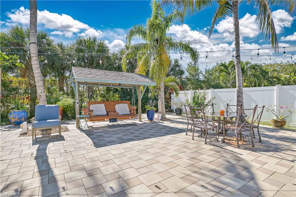 Fenced backyard featuring a patio and outdoor lounge area