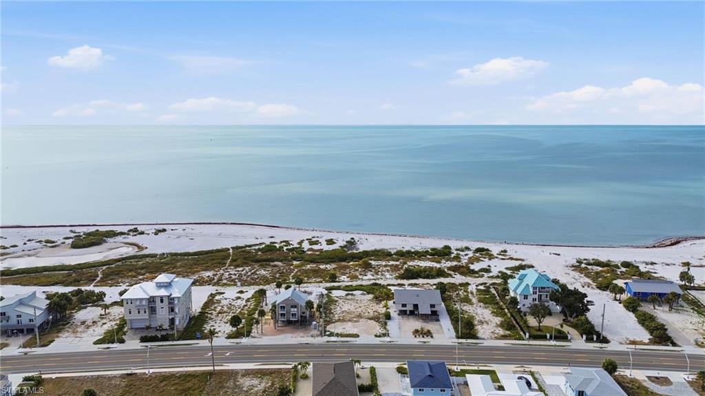 Aerial perspective of suburban area with a nearby body of water