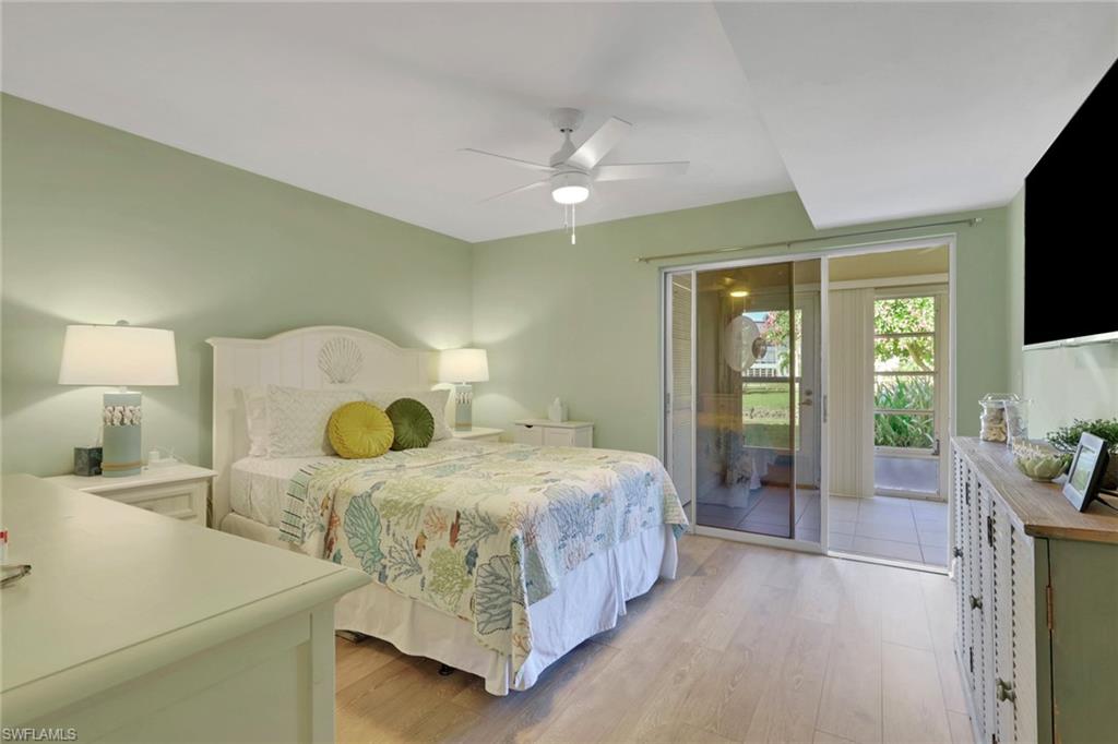 Primary bedroom with slider access to sunroom