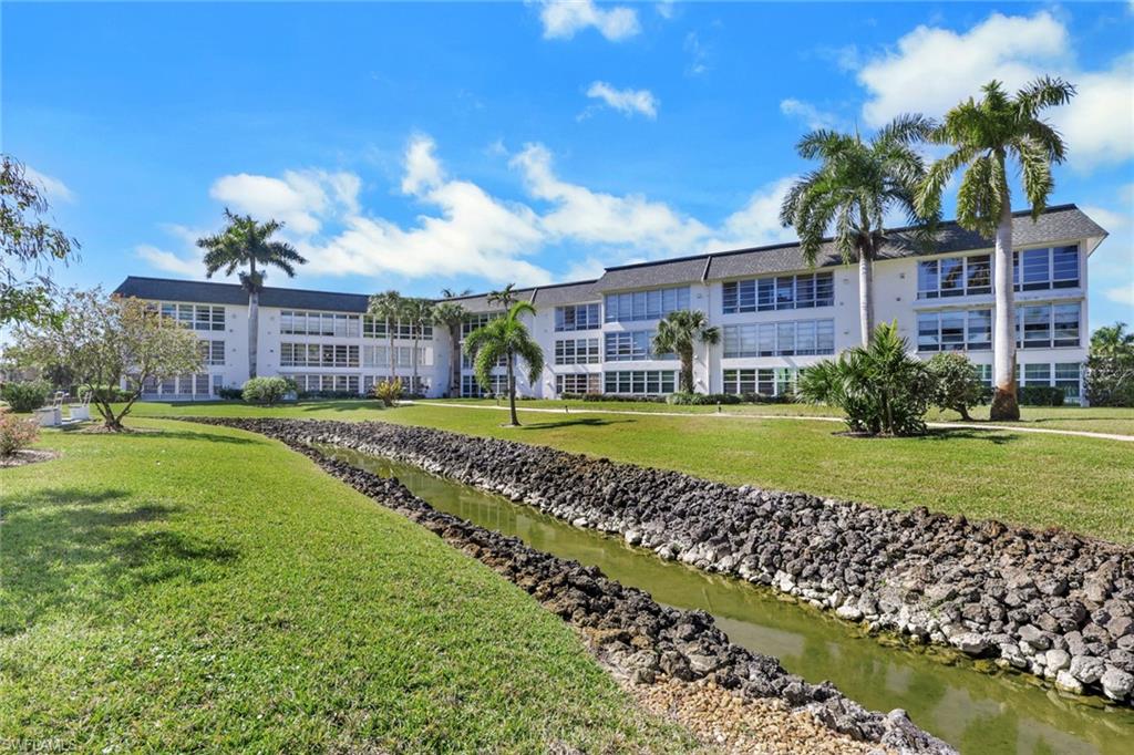 Beautiful grounds with a tranquil moat around the amenity center.center